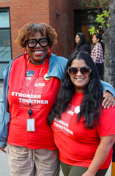 Two female colleagues enjoying the Block Party